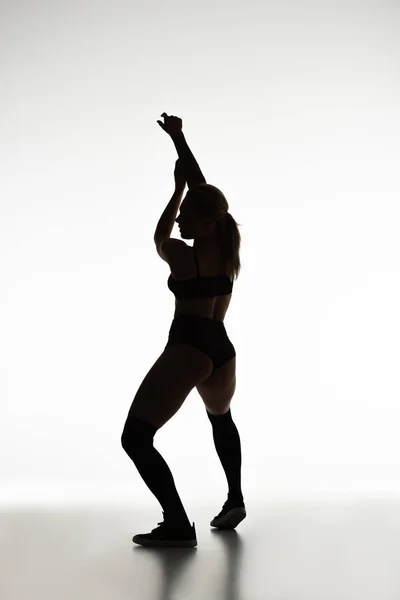 Silhueta de sexy menina twerking isolado no branco — Fotografia de Stock