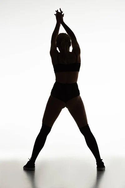 Back view de silhueta de sexy menina twerking isolado no branco — Fotografia de Stock