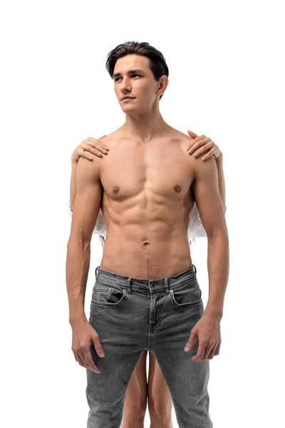 Girl standing behind sexy shirtless man, isolated on white — Stock Photo