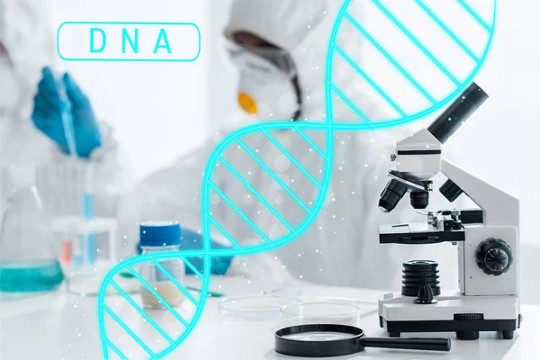 Selective focus of microscope and magnifying glass with dna illustration — Stock Photo