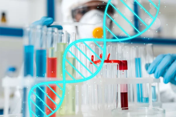 Selective focus of african american holding test tube with dna illustration — Stock Photo