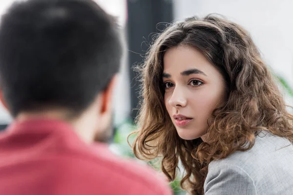 Selective focus of account manager looking at her colleague — Stock Photo