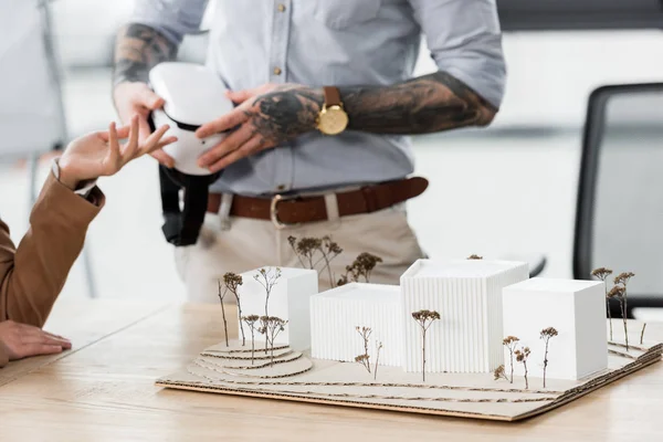 Selective focus of house model and virtual reality architects on background — Stock Photo