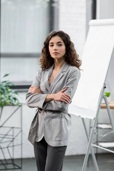 Attractive account manager with crossed arms looking at camera — Stock Photo
