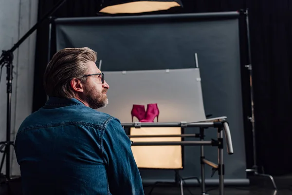 Side view of happy art director in glasses — Stock Photo