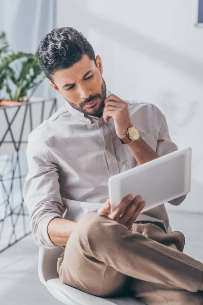 Handsome mixed race scrum master using digital tablet — Stock Photo