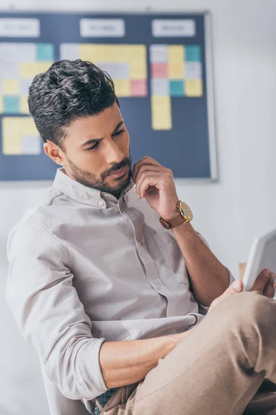 Bearded mixed race scrum master using digital tablet — Stock Photo