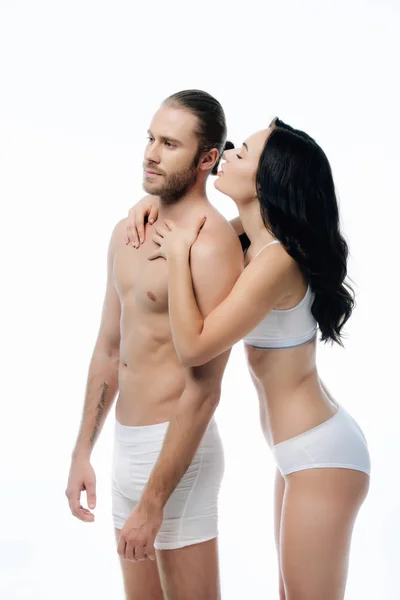 Couple passionné câlin en sous-vêtements blancs, isolé sur blanc — Photo de stock