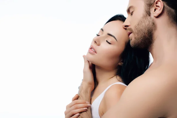 Young sensual couple hugging in white underwear, isolated on white — Stock Photo