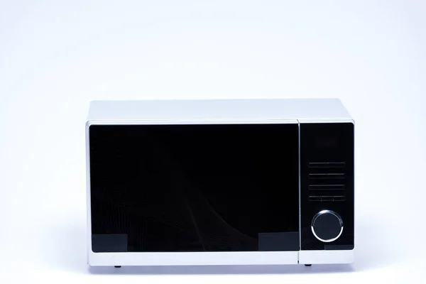 Metal and electrical microwave oven on white background — Stock Photo