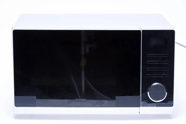 Metal and electrical microwave oven on white background — Stock Photo