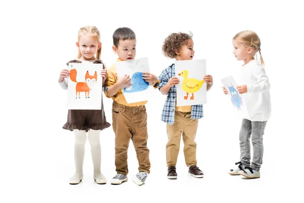 Multicultural kids holding paintings, isolated on white — Stock Photo
