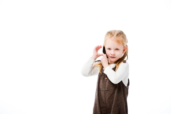 Lindo niño hablando en el teléfono inteligente, aislado en blanco - foto de stock