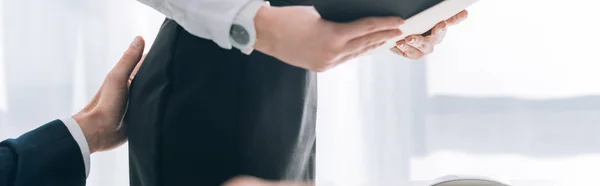 Panoramic shot of businessman touching butt of secretary in office — Stock Photo