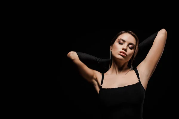 Beautiful woman in gloves isolated on black — Stock Photo