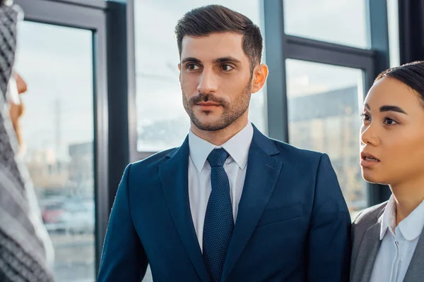 Multicultural business partners on meeting with translator in office — Stock Photo