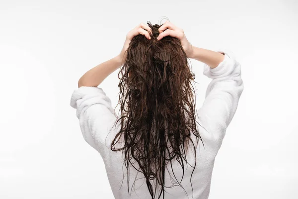 Back view of young woman touching clean long hair isolated on white — Stock Photo