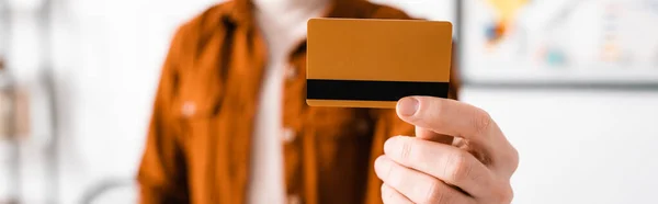 Selective focus of digital designer holding credit card, panoramic shot — Stock Photo