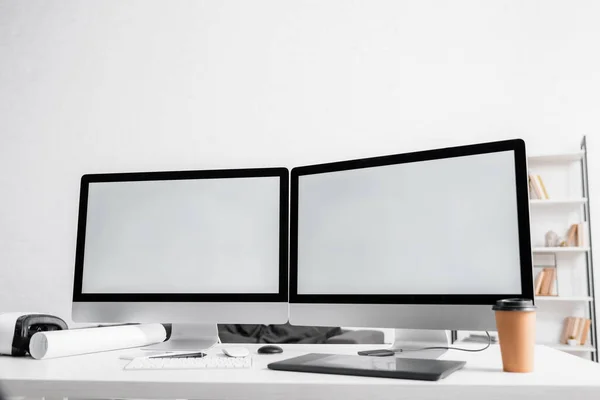 Computers, graphics tablet with coffee to go and vr headset on table in office — Stock Photo