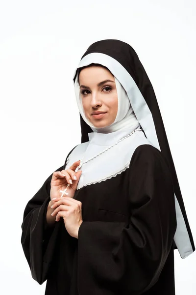 Beautiful smiling nun holding cross, isolated on white — Stock Photo