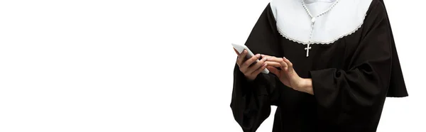 Panoramic shot of nun using smartphone isolated on white — Stock Photo