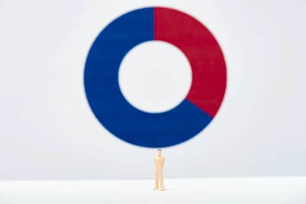 Concept of inequality with people figure on white surface with red and blue diagram at background — Stock Photo