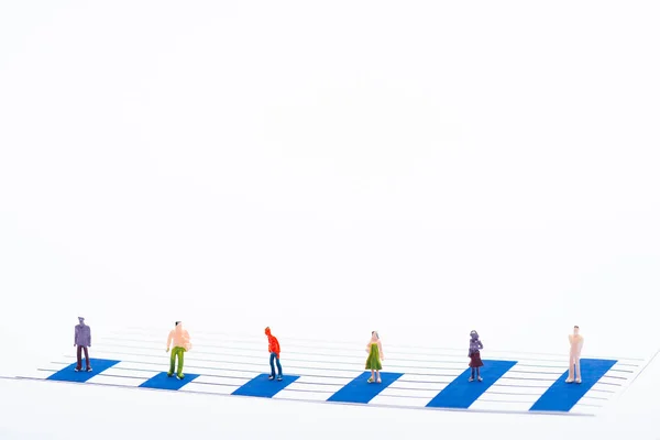 Concept of equality with people figures on surface of blue graphs isolated on white — Stock Photo