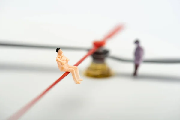 Selective focus of people figures on arrows of clock on grey background, concept of aging — Stock Photo