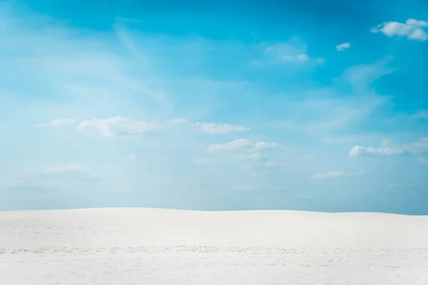 Beautiful clean beach with white sand and blue sky with white clouds — Stock Photo