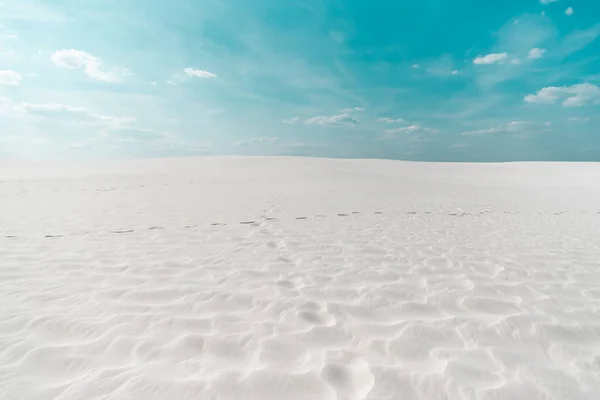 Beautiful clean beach with white sand and blue sky with white clouds — Stock Photo