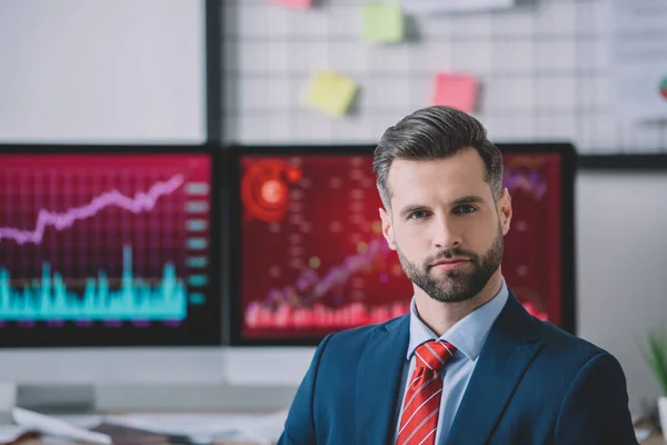 Handsome data analyst looking at camera in office — Stock Photo
