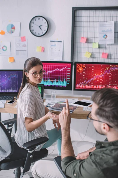 Selective focus of data analysts planning work near charts on computer monitors — Stock Photo