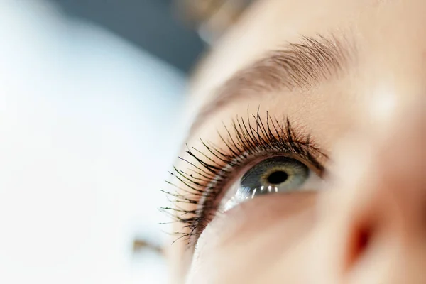 Low angle view of woman with mascara on eyelashes — Stock Photo
