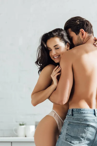 Hot girl with closed eyes smiling and hugging with boyfriend — Stock Photo