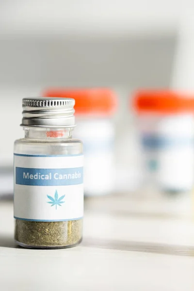 Selective focus of bottle with medical cannabis lettering — Stock Photo