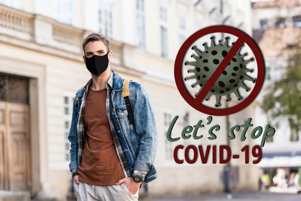 Hombre guapo en máscara médica con las manos en los bolsillos en la calle, stop covid-19 ilustración - foto de stock