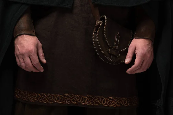 Close up view of medieval Scottish man in mantel with leather bag — Stock Photo