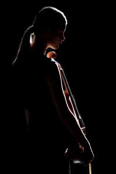 Silhouette of female musician holding violin isolated on black — Stock Photo