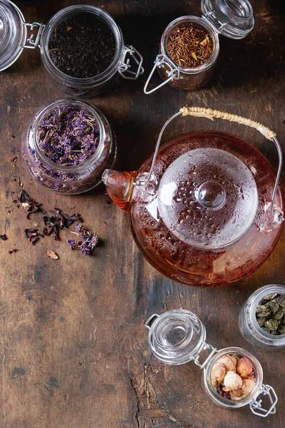 Variety of dry tea with teapot — Stock Photo, Image