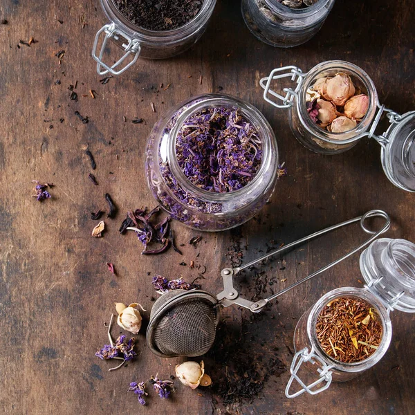 Variety of dry tea with teapot — Stock Photo, Image