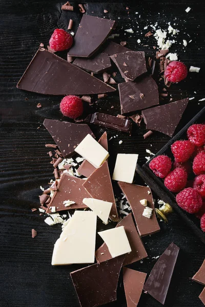 Variety of chopping chocolate with raspberries