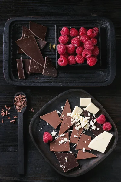 Variety of chopping chocolate with raspberries