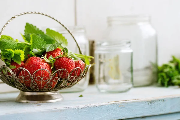 Fresh strawberries and melissa herbs — Stock Photo, Image
