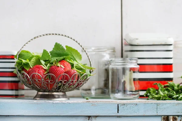 Fresh strawberries and melissa herbs — Stock Photo, Image