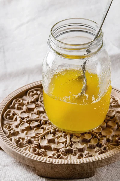 Glass of ghee butter — Stock Photo, Image