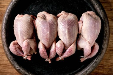 Raw uncooked quails