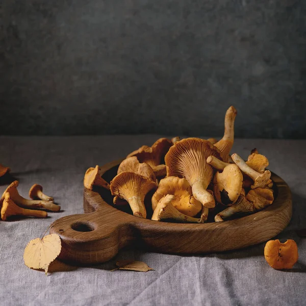 Forest Chanterelle Mushrooms Raw Uncooked Wooden Cutting Board Yellow Autumn — Stock Photo, Image