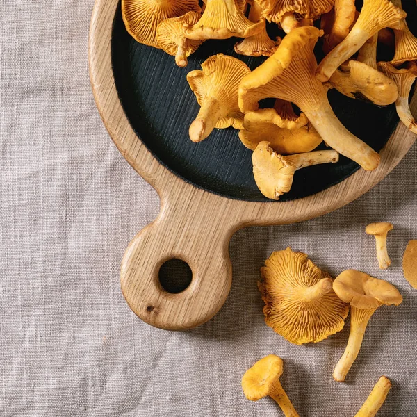 Forest Chanterelle Mushrooms Raw Uncooked Wooden Cutting Board Yellow Autumn — Stock Photo, Image