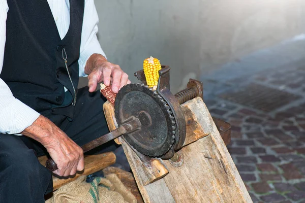 Antique machine for grinding maize cobs — Stock Photo, Image