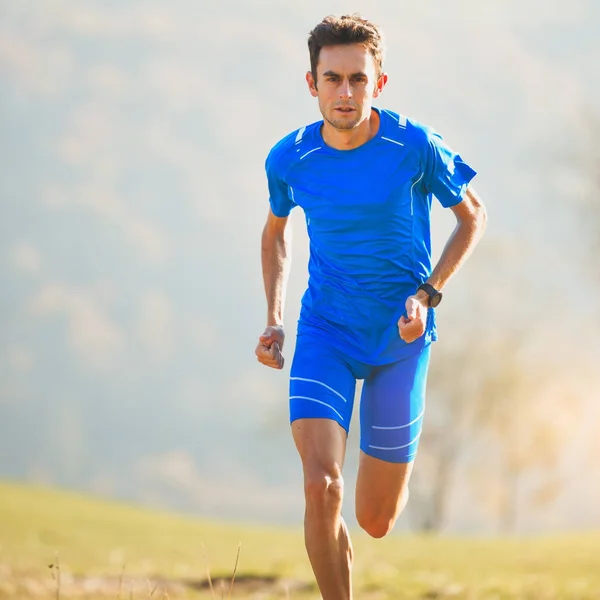 Athlete running in the mountains of the Italian national team in